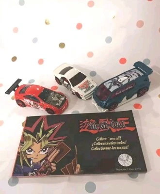 YuGiOh Hot Wheels Lot of 3 Diecast Vehicles With Flip Book - Image 1 of 4