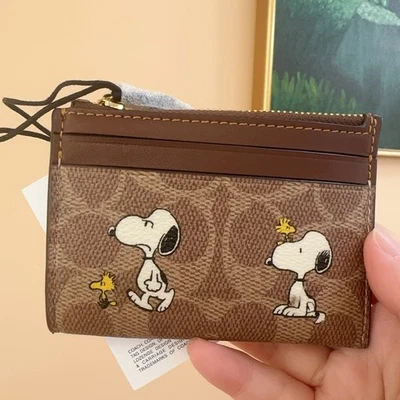 Coach X Peanuts Mini Skinny Id Case In Signature Canvas With Snoopy Print In Tan - Image 1 of 4