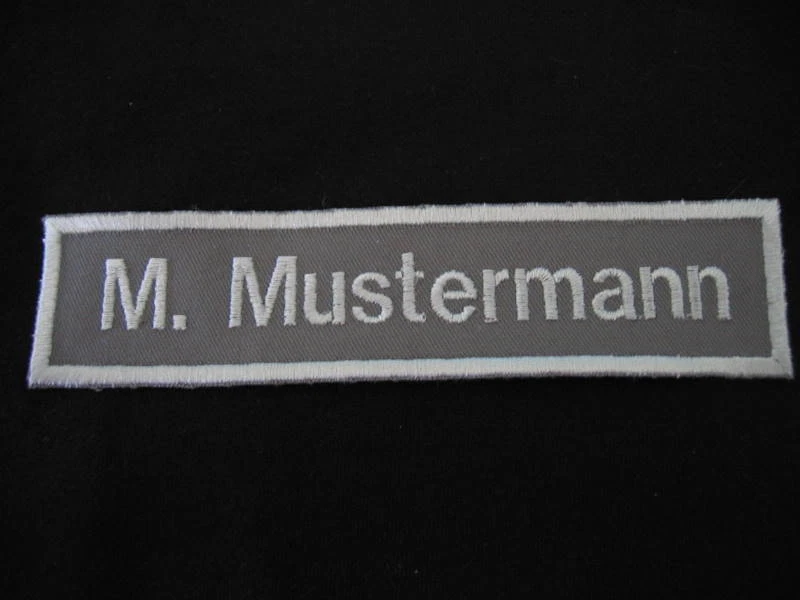 Namensschild  grau/silber gestickt  Namen Namenschild Namenschilder Bonn 2000   - Bild 1 von 1