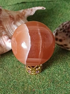 Esfera de piedras preciosas talladas en calcita de miel 208 g - Imagen 1 de 3