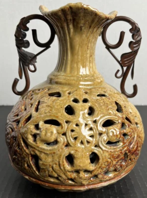 Jarrón portavelas con forma de soporte redondo asas de metal de cerámica 3975 decoración del hogar Foto 1 de 4