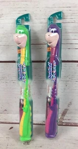 Vintage Lot Of 2 Aquafresh Flexosaurus Dinosaurs Kids Toothbrush Green Purple - Picture 1 of 12