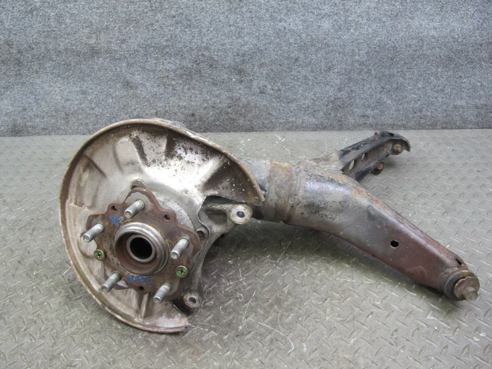 86-91 MAZDA RX7 FC3S HUSILLO TRASERO IZQUIERDO NUDILLO RUEDA BUJE CON BRAZO DE ARRASTRE CONJUNTO OEM Foto 1 de 4