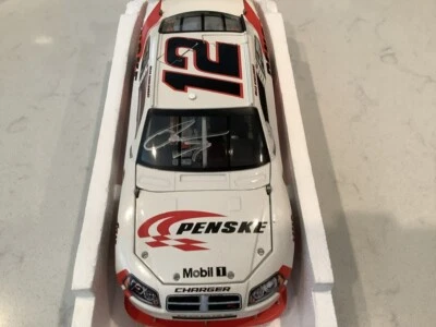 BRAD KESELOWSKI AUTOGRAPHED 2010 DODGE CHARGER PENSKE MOBIL 1 COT DIECAST & CARD - Image 1 of 4