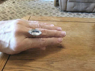 Brand new gold tone Adjustable ring with a Huge Clear Resin Crystal.  - Image 1 of 4