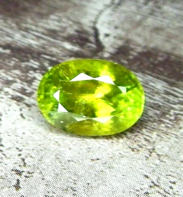 2.7ct Green Chrome Sphene Pleochroic Natural Mined Unheated Faceted Oval Russia - Image 1 of 4
