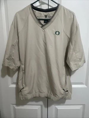 Nike Golf Oregon Ducks Men’s Medium Short Sleeve Pullover Tan V-Neck Pockets - Image 1 of 4