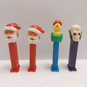 4 Vintage PEZ Spender 2 Weihnachtsmänner, Osterküken und Dr. Totenkopf #J503 - Bild 1 von 10