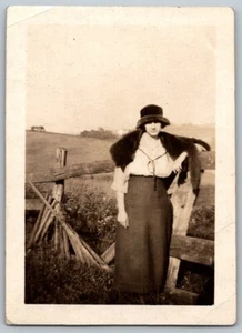 1920s Original Snapshot Photograph Farm Girl Leaning Fence Fur Stole Hat Skirt - Picture 1 of 2