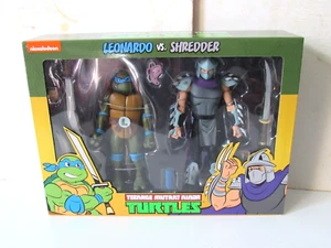 NECA Teenage Mutant Ninja Turtles dibujos animados Leonardo vs Shredder paquete de 2 SELLADOS - Imagen 1 de 11