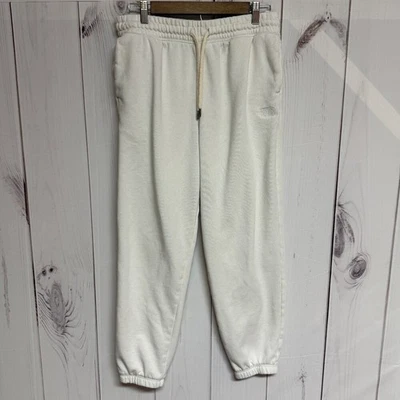 Pantalones deportivos The North Face acogedores para mujer medianos marfil polar usados en excelente estado Foto 1 de 4