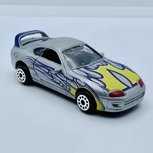 MotorMax Toyota Supra 1/64 Diecast Silver w/ Yellow & Purple Flames (Loose) - Picture 1 of 5