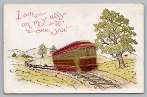 Postcard I am on My Way to See You Train Trolley Track Rose Co Embossed Unposted - Picture 1 of 2
