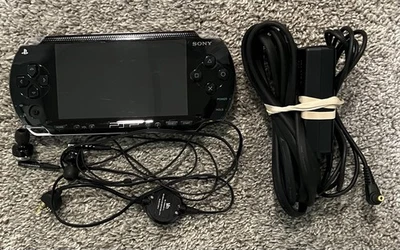 PSP 1001 Black Console Bundle With Sony PSP Headphones, Charger, & Memory Stick - Image 1 of 4