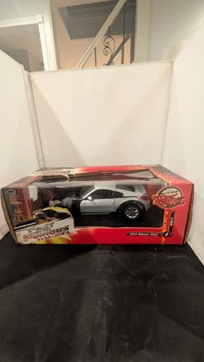 NISSAN 350Z A ESCALA 1/18 EN PLATA POR JOYRIDE-(RC-2-ERTL) # 37460 Foto 1 de 4
