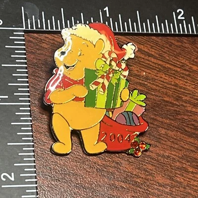 DISNEY UK STORE CHRISTMAS 2004 WINNIE THE POOH AS SANTA WITH PRESENTS PIN - Image 1 of 4