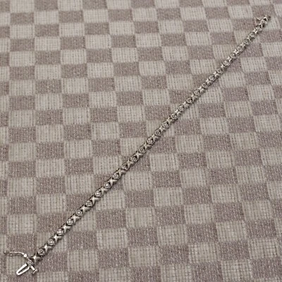 NEW TEN KARAT WHITE GOLD NATURAL DIAMOND "X" LINK TENNIS BRACELET (7.25 inch) - Image 1 of 4