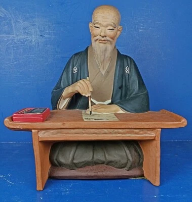 VINTAGE JAPANESE CLAY HAKASTA URASAKI ‘NEW YEAR'S WRITING CEREMONY’ DOLL - Image 1 of 4