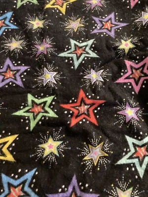 3/4 Yard X WOF (38”ish) Of Black Flannel Fabric With Multicolored Stars - Image 1 of 2
