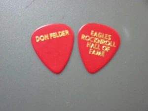 Eagles plettro chitarra Don Felder ROCKNROLL Hall of Fame plettro rosso! - Foto 1 di 1