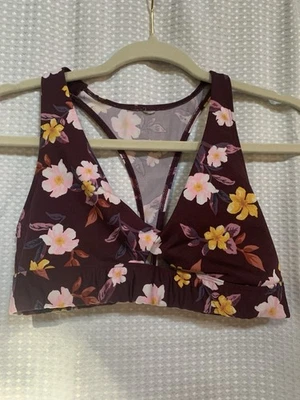 Top de ejercicio rosa para mujer pequeño Foto 1 de 4