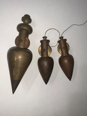 3 Antique Brass Plumb Bob w/ Integrated Reels 2- Stanley 4 1/8” & 1 Umbaugh 6.5” - Image 1 of 4