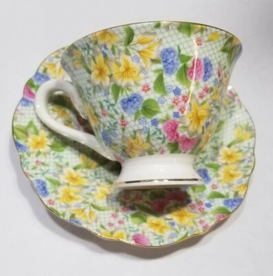 TAZA DE TÉ GRACE'S BLANCA CON ÓVALOS VERDES AMARILLO NARCISO FLORES TAZA DE TÉ Y SACUR Foto 1 de 4