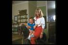 TV presenter Lesley Judd at home with her son on a rocking hors- TV Old Photo