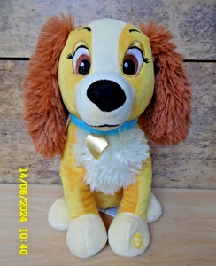 P17/ DISNEY  PELUCHE CHIEN SONORE MUSICAL LADY LA BELLE ET LE CLOCHARD 30CM NEUF - Picture 1 of 5