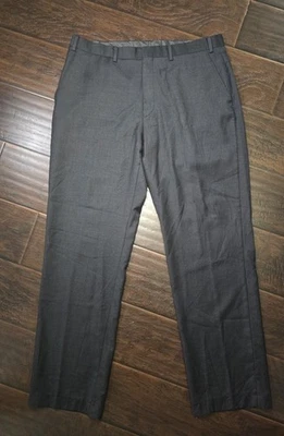Pantalones de vestir informales calce ajustado negros de lana Calvin Klein para hombre 36Wx32L Foto 1 de 4