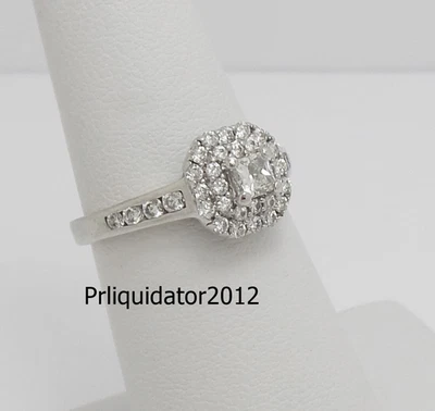 Anillo de compromiso nupcial de oro blanco de 14 K con marco de halo de diamantes naturales de 5/8 quilates Foto 1 de 4