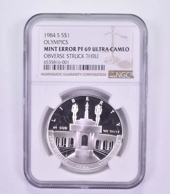 Mint Error PF69 UCAM 1984-S Los Angeles Olympics - OBV Struck Thru - NGC *9609 - Image 1 of 3