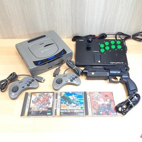 Sega Saturn console with Virtua Gun, Hori Fighting Stick, 2 controllers &3 Games
