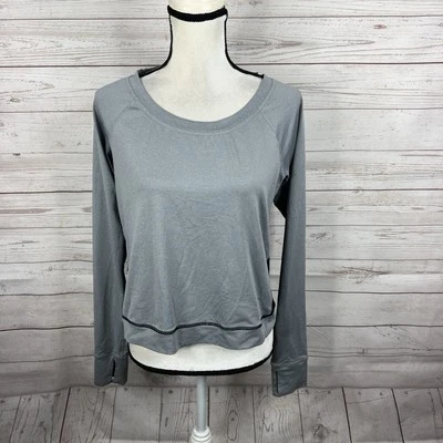 Top corto deportivo Lucy para mujer talla mediana gris negro manga larga agujeros para los pulgares Foto 1 de 4