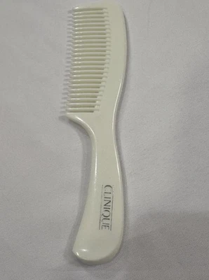 Peine desenredante de dientes anchos vintage de plástico duro blanco Clinique 7" Foto 1 de 2