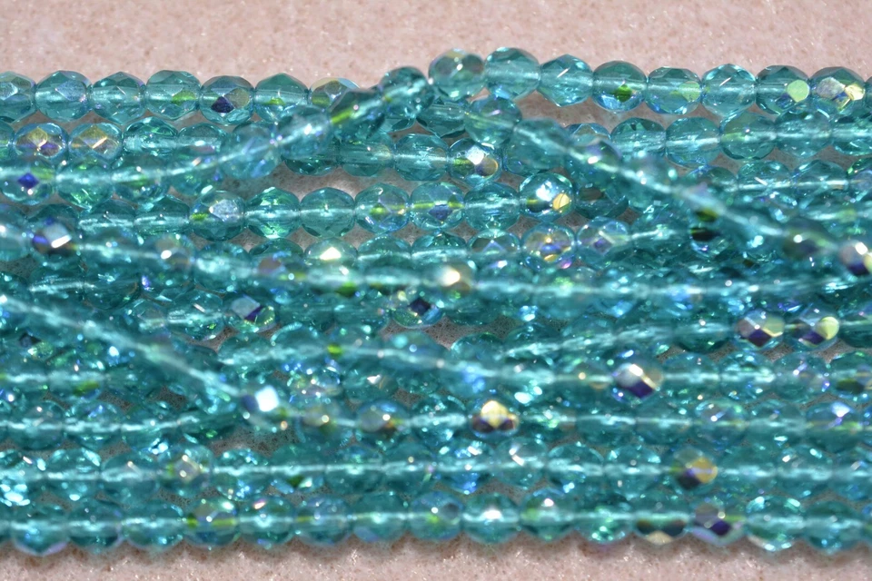Czech Fire Polished 4mm round faceted glass beads - Teal AB - Image 1 of 1