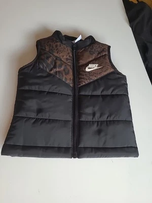 The Kids Nike Full Zip Vest In Black Size 2t Is A Stylish Puffer Vest - Image 1 of 4