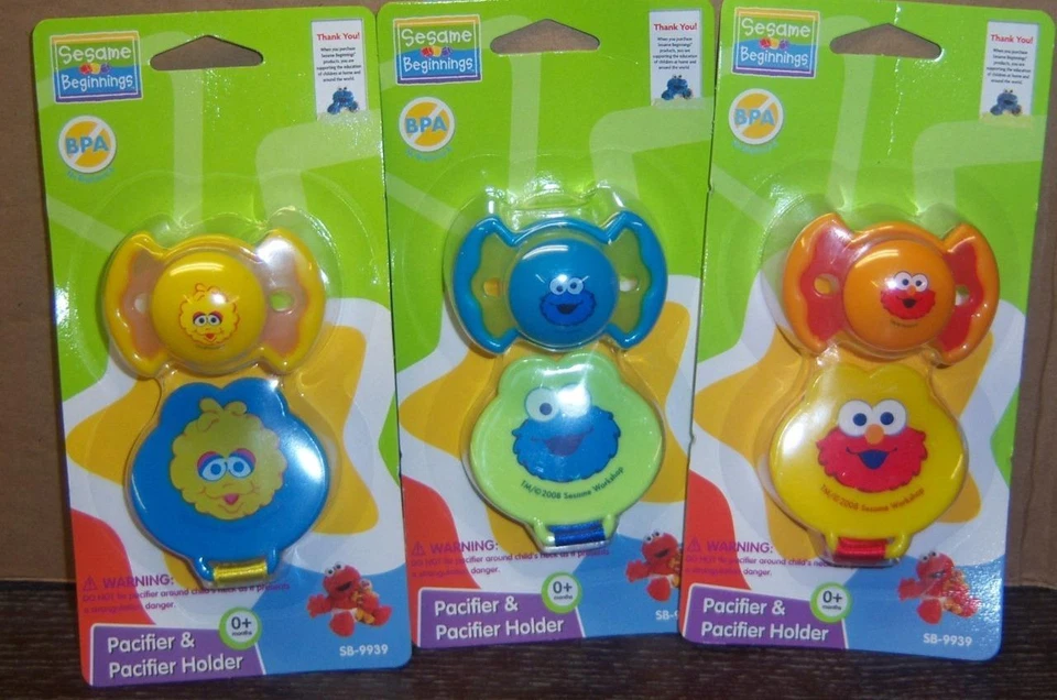 Chupete y soporte Sesame Street Beginnings, Elmo, Big Bird o Cookie Monster Foto 1 de 1