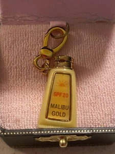 NWT and box Juicy Couture Mabilu Tan sunscreen Charm # - Picture 1 of 11