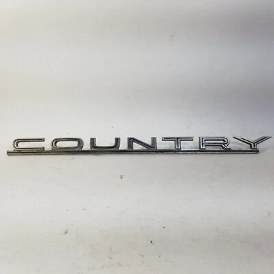 Ford "Country" 1965 sedán/Squire guardabarros delantero adorno emblema cromado Foto 1 de 4