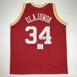 Autographed/Signed Hakeem Olajuwon Houston Red Basketball Jersey Beckett COA - Picture 1 of 4