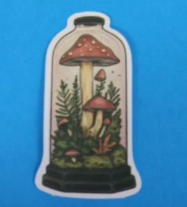 Red Toadstools Growing On Moss Inside Glass Jar Sticker 2.78" x 1.58" (AA) - Picture 1 of 2