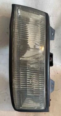 Faro Chevy Corsica LH 1988 pequeño chip usado OEM Foto 1 de 4