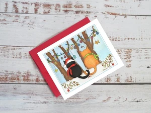 Cute Christmas Cats, ginger and black cat in the woods,  notecard #0481 - Picture 1 of 3
