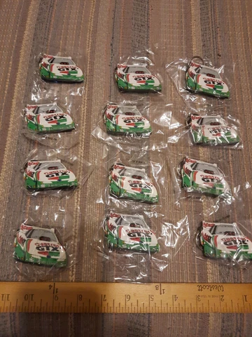 Lot of 12 1997 John Force Ford Castrol Drag Racing Keychains Cover
