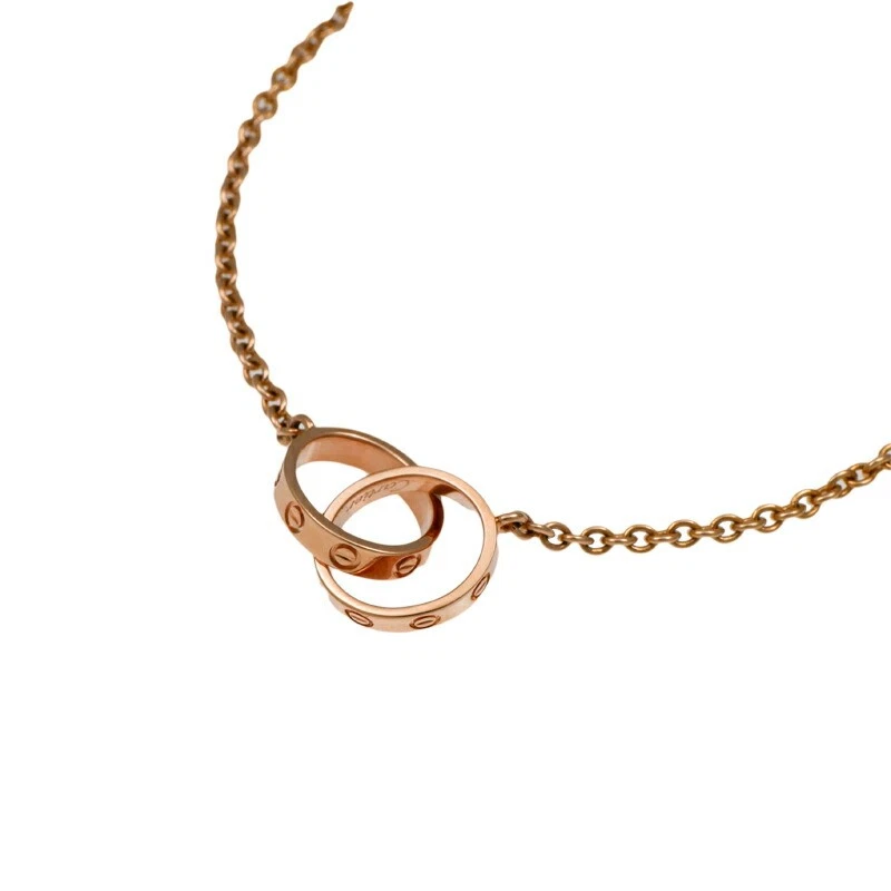 Auténtico brazalete CARTIER Baby Love cadena oro rosa 18 quilates anillo doble encanto Foto 1 de 4