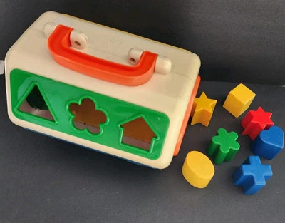 Clasificador de formas vintage juguete caja azul reloj lateral con mango de viaje y bloques Foto 1 de 4