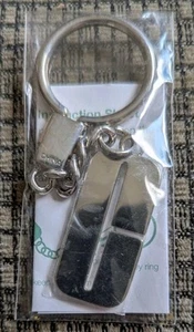 Portachiavi firma CLINIQUE tono argento logo C portachiavi NUOVO/NON APERTO - Foto 1 di 5