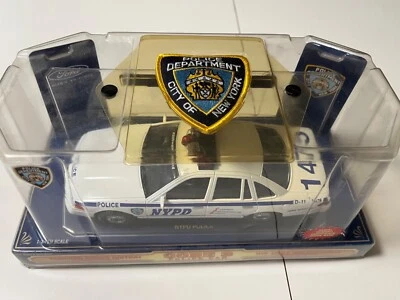 NYPE Die-Cast Collectible Police Car with NYC Patch in original packaging 1/24 - Image 1 of 4