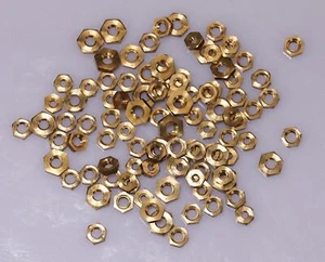 100 BRASS CLOCK NUTS ASSORTED clockmakers parts spares repairs 3-7mm movement - Picture 1 of 4